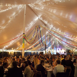 Streamers & fairy lights in a traditional marquee built in Bath by Archers Marquees