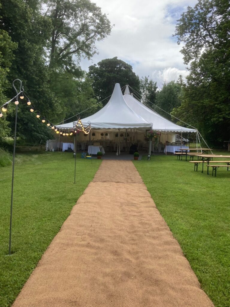 Coconut matting pathway with festoon lights