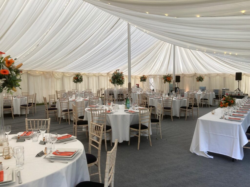 Pleated ivory lining in a traditional marquee