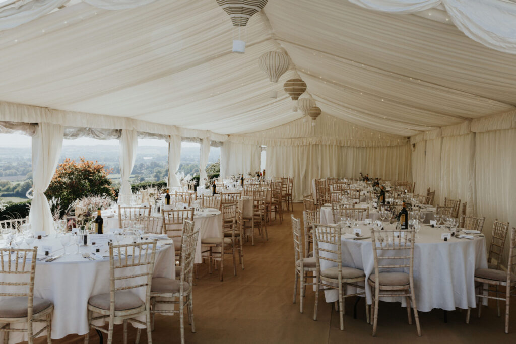 Pleated ivory lining in a clearspan marquee