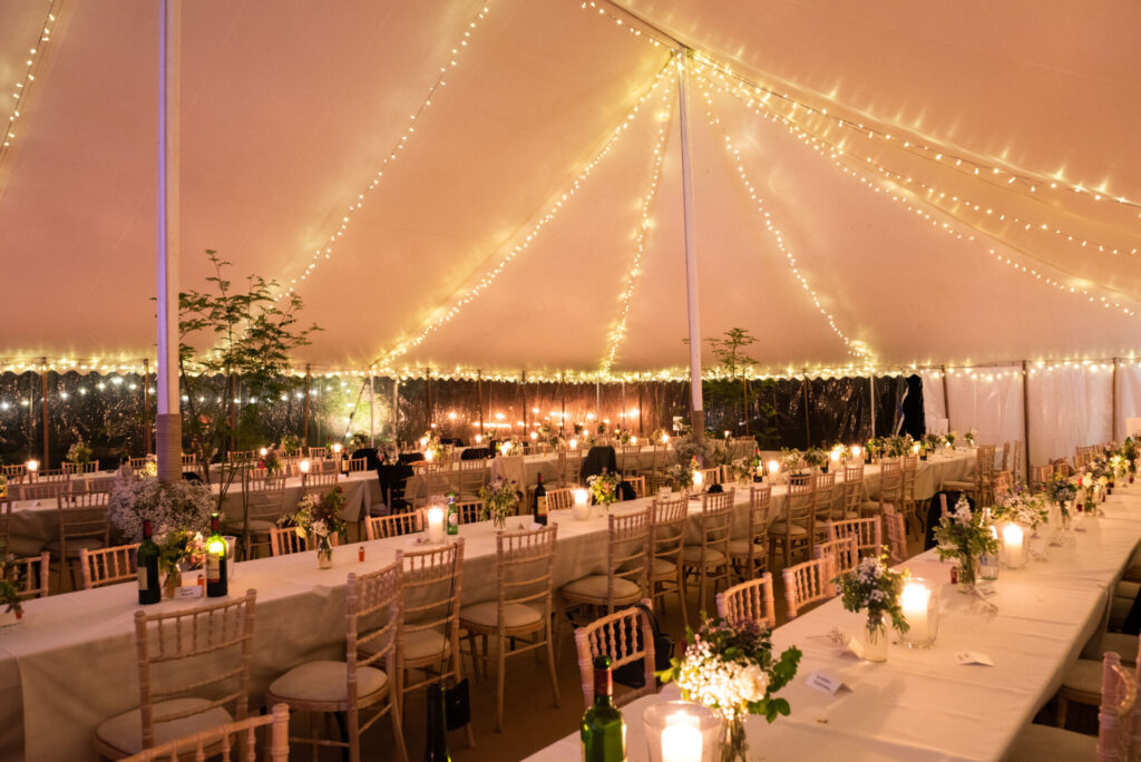 Fairy lights in the roof of a traditional marquee